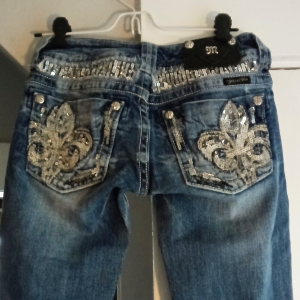Miss Me low rise boot cut jeans in size 26, featuring sequins and embroidered ac